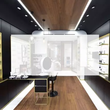 A modern skincare store interior featuring product displays on shelves, a central mirror, and informative wall texts in both English and French.