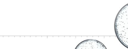 Des plaques de Petri avec des bulles d'air, sur fond blanc, illustrant un concept scientifique.