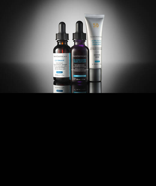Deux ecrans solaires SkinCeuticals SPF 50 15 ml : Ultra Facial UV Defense et Advanced Brightening UV Defense ainsi que deux serums antioxydants : C E Ferulic et Phloretin CF presentes sur fond noir.