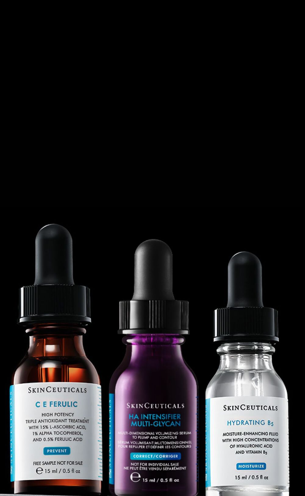 Trois flacons de serum en verre avec pipettes, disposes sur un fond sombre. Les etiquettes indiquent des ingredients actifs pour des soins de la peau.