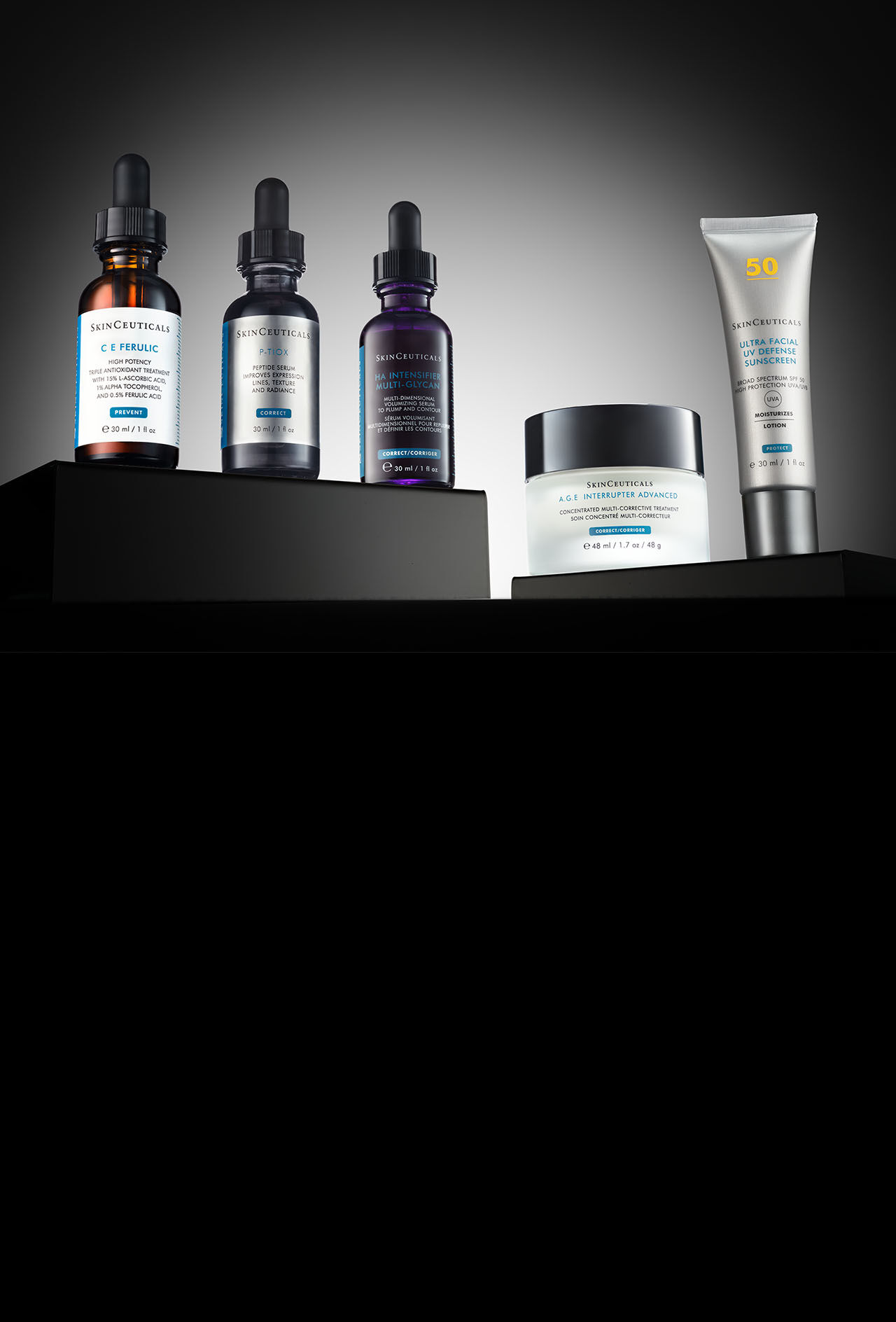 Deux ecrans solaires SkinCeuticals SPF 50 15 ml : Ultra Facial UV Defense et Advanced Brightening UV Defense ainsi que deux serums antioxydants : C E Ferulic et Phloretin CF presentes sur fond noir.  