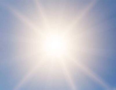 Une image representant un ciel lumineux avec un soleil eclatant au centre.